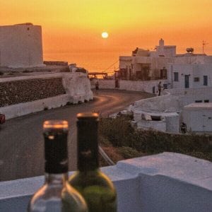 wine and sunset in Santorini, Greece itinerary