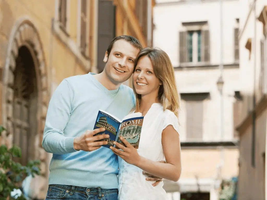 Couple looking at Europe Guidebook